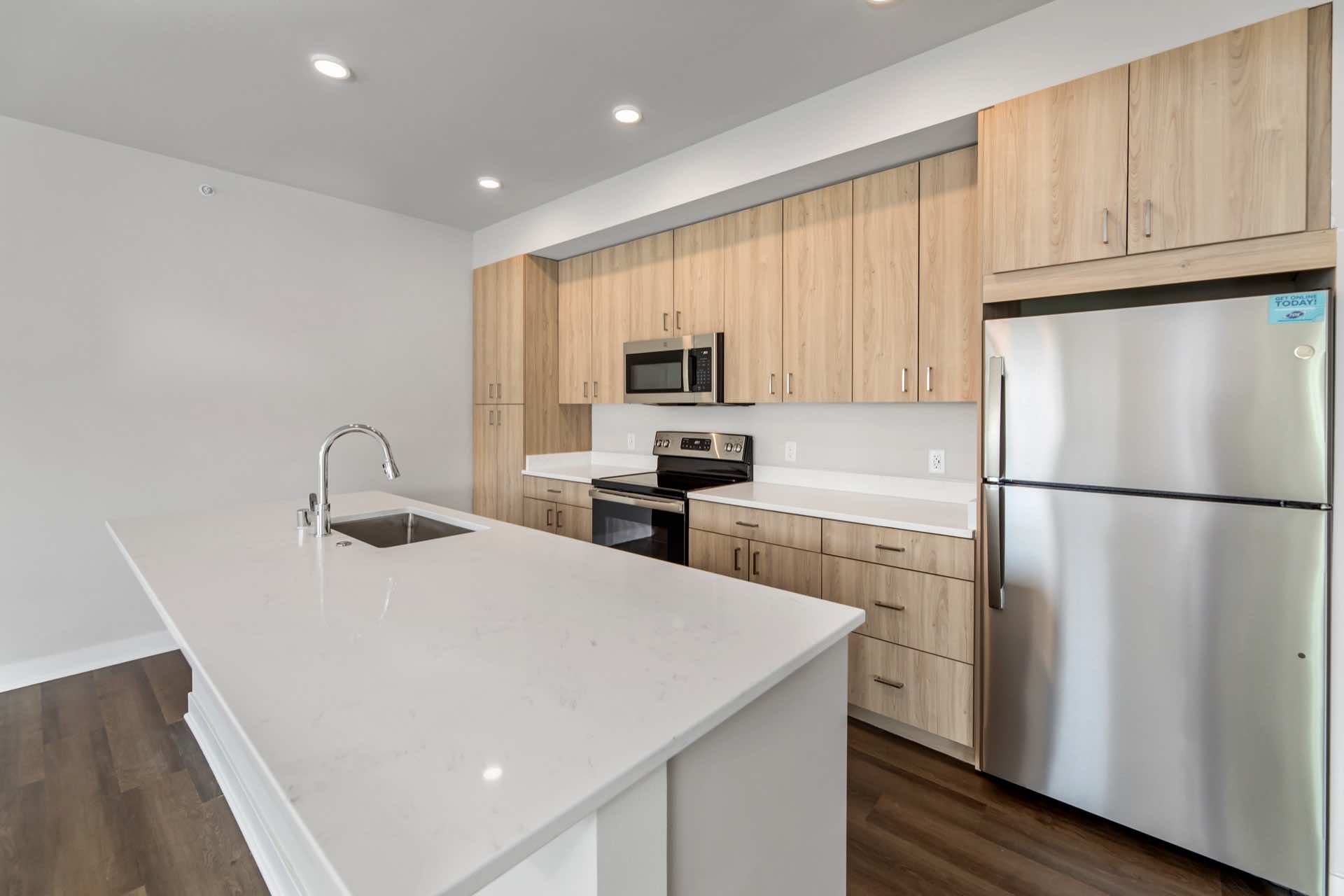 Large kitchen with island and stainless-steel appliances